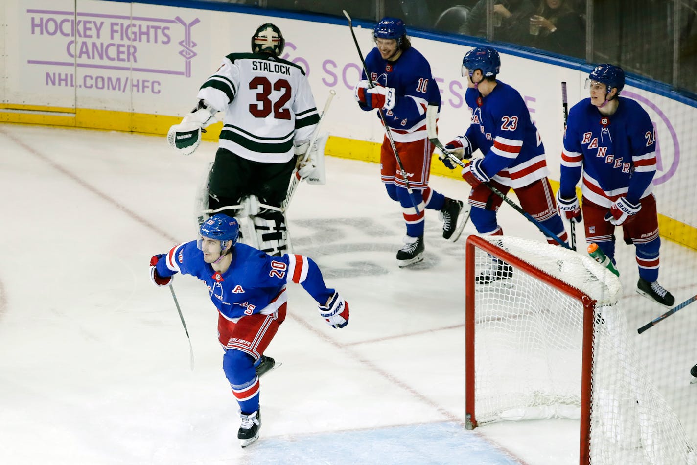 Rangers center Chris Kreider (20) skated past Wild goaltender Alex Stalock after scoring the game-tying goal in the third period Monday. The Rangers won 3-2, scoring on their first shot in overtime.