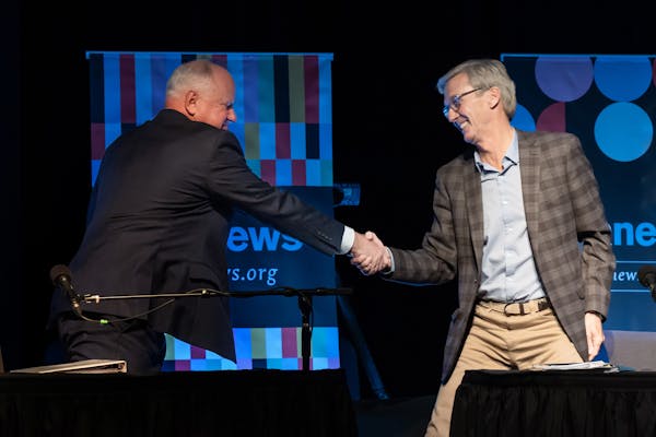Governor Tim Walz and GOP challenger Scott Jensen shook hands after facing off in their final debate held at the Fitzgerald Theater Friday, Oct. 28, 2