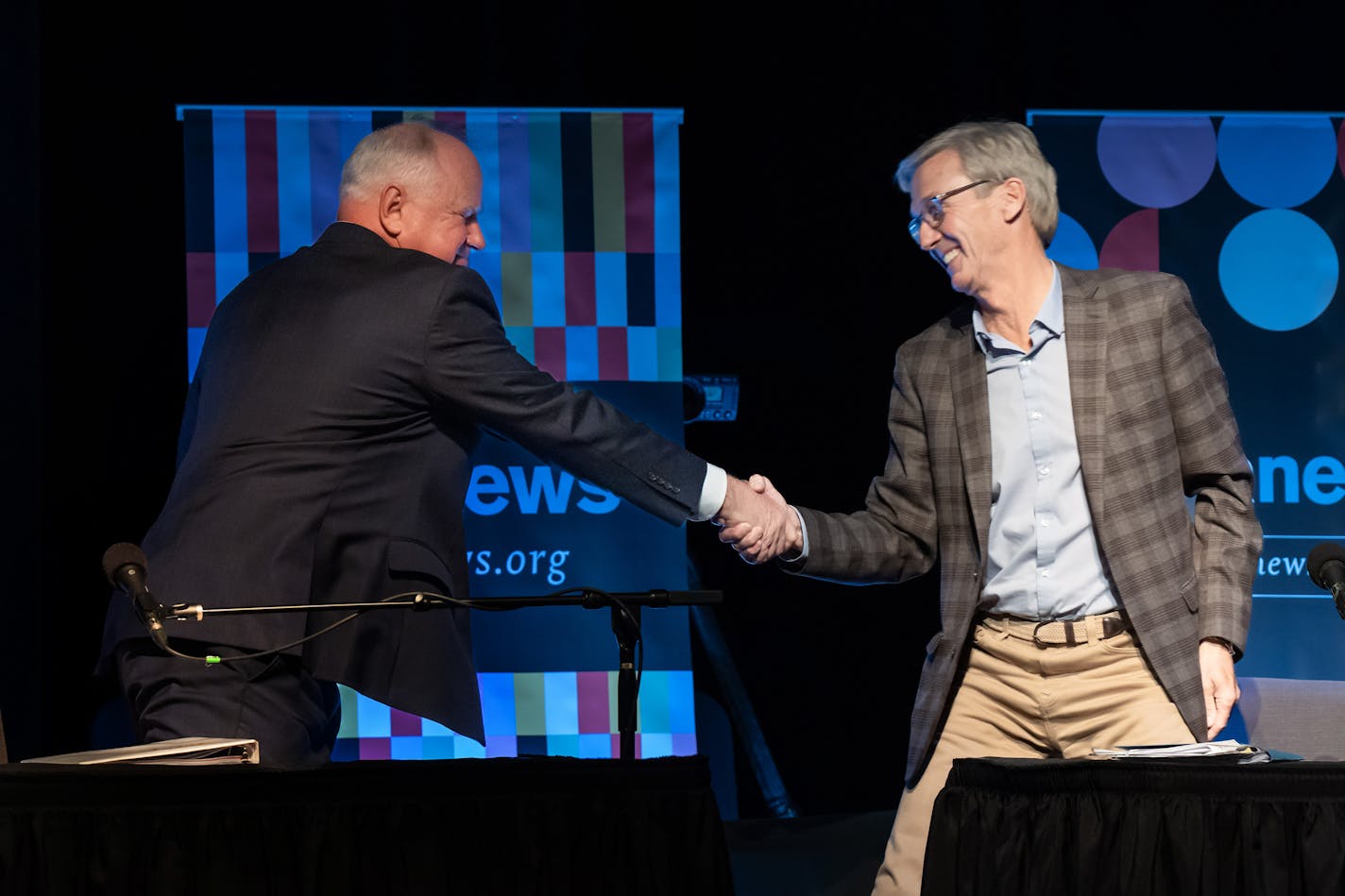 Governor Tim Walz and GOP challenger Scott Jensen shook hands after facing off in their final debate held at the Fitzgerald Theater Friday, Oct. 28, 2022 St. Paul, Minn. ] GLEN STUBBE • glen.stubbe@startribune.com