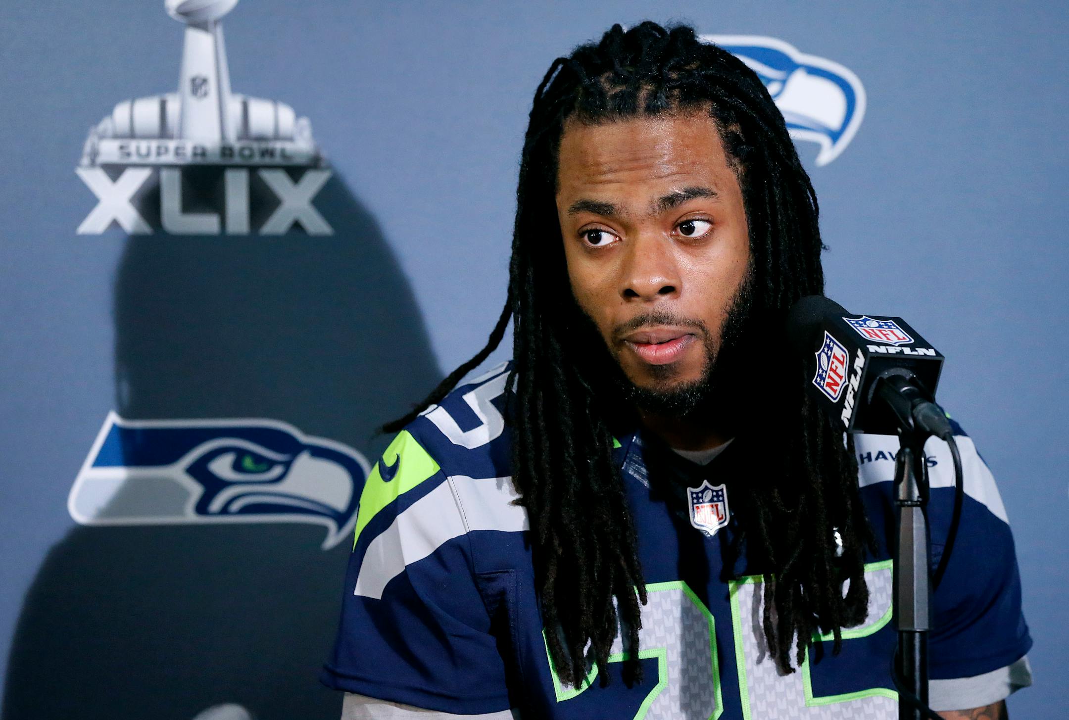 Seattle Seahawks' Richard Sherman answers a question at a news conference for NFL Super Bowl XLIX football game, Wednesday, Jan. 28, 2015, in Phoenix. The Seahawks play the New England Patriots in Super Bowl XLIX on Sunday, Feb. 1, 2015. (AP Photo/Matt York)
