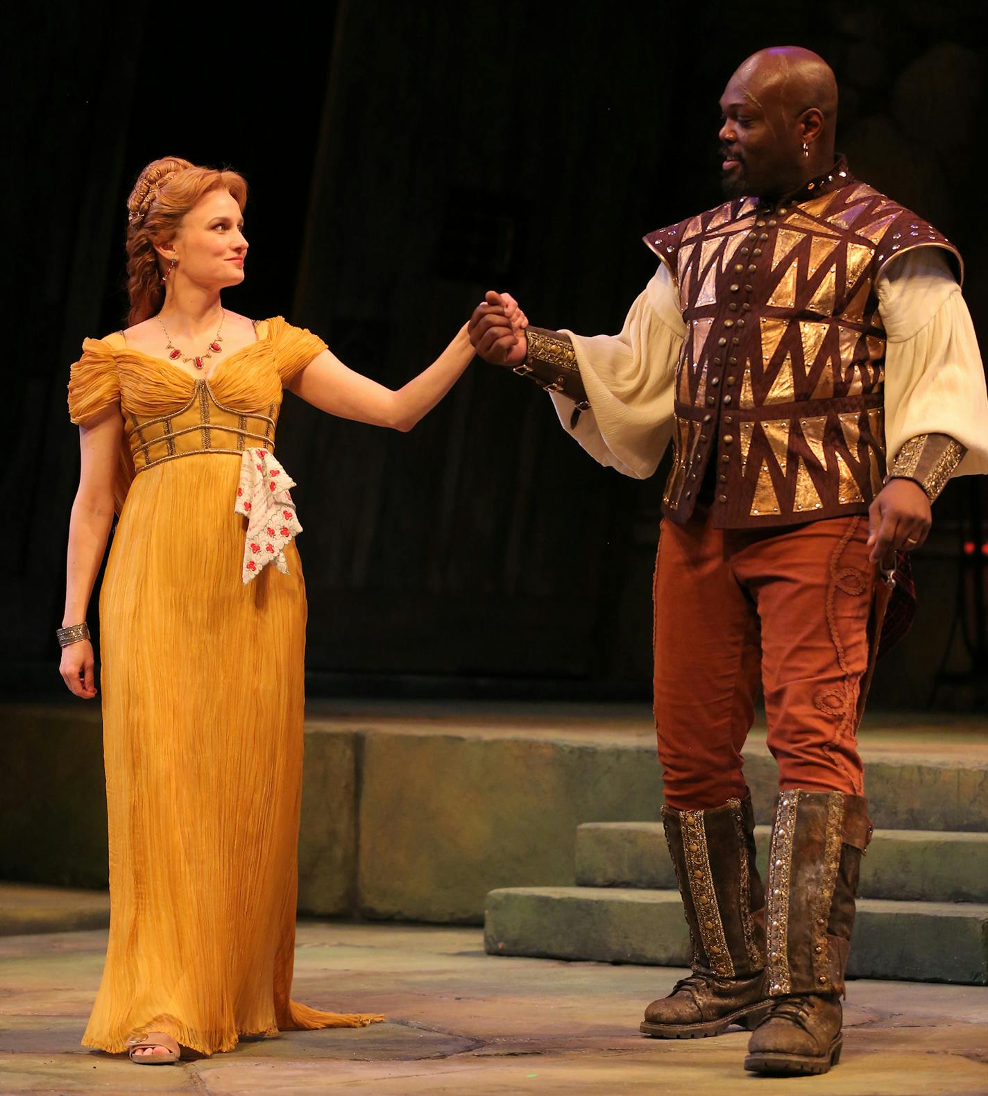 Tracey Maloney (Desdemona) and Peter Macon (Othello) in the Guthrie's production of Othello, by William Shakespeare. Directed by Marion McClinton, set design by Marjorie Bradley Kellogg, costume design by ESOSA and lighting design by Michael Wangen. March 8 - April 20, 2014 on the Wurtele Thrust Stage at the Guthrie Theater, Minneapolis. Photo by Joan Marcus.