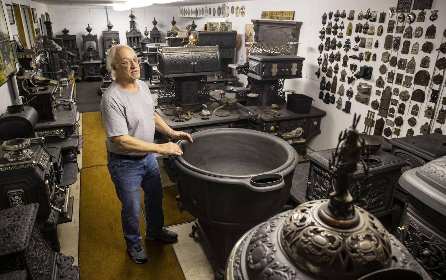 Dennis Gunsolus stood among his vast collection of over 200 antique stoves in the basement of his home in Duluth.