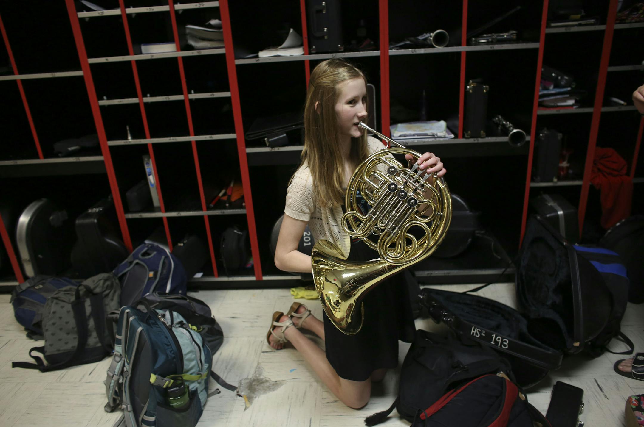 Kamilla Ruppman tested out different french horns to see which one she should take with her over the summer after band practice at Henry Sibley High School in Mendota Heights, Min., Tuesday, June 6, 2013. ] (KYNDELL HARKNESS/STAR TRIBUNE) kyndell.harkness@startribune.com