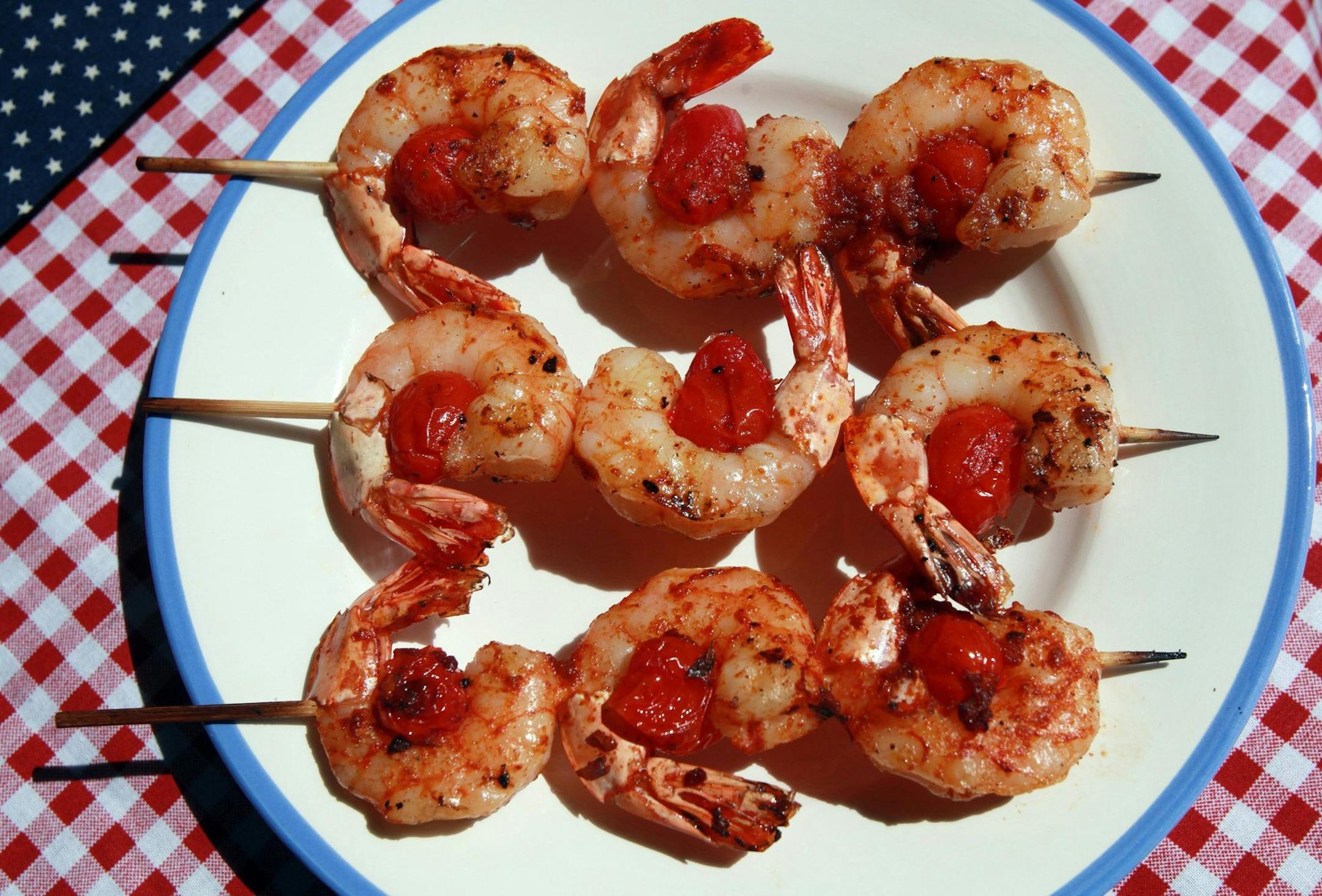 Skewering shrimp on the grill, such as these shrimp and sausage skewers with smoky paprika glaze, prevents the risk of losing a shrimp through the grates, as well as ensuring they cook evenly. (Regina H. Boone/Detroit Free Press/MCT) ORG XMIT: 1155326
