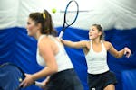 Breck's Petra Lyon backhands the ball against Providence Academy during the first day of singles and doubles competition at the Class 1A girls' tennis