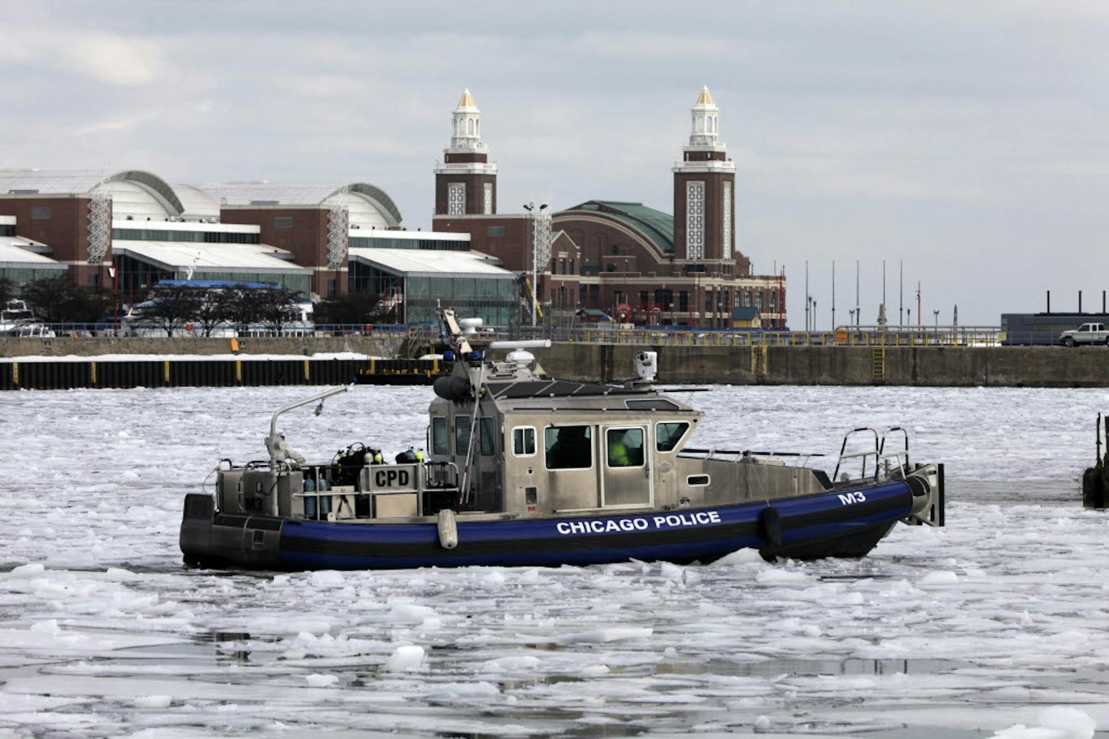 A search crew of the Chicago Police Department's marine unit returns to the marine safety station in Chicago after their search for 21-year-old Lauren Li. Here body was pulled from the river on Wednesday.