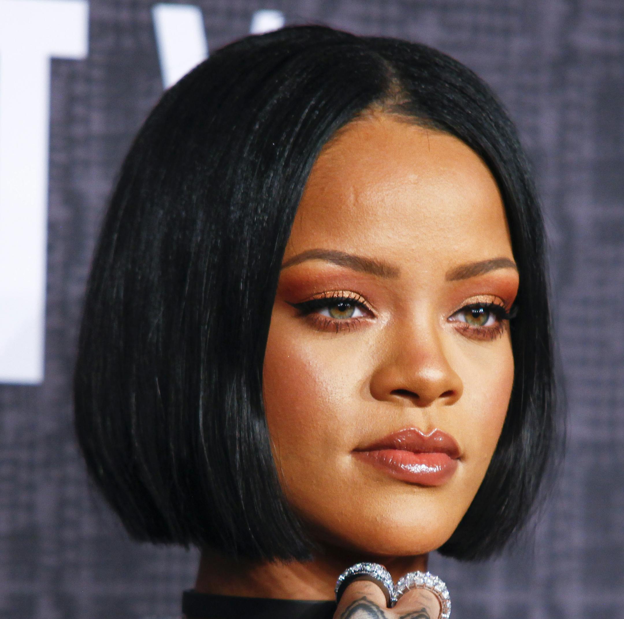 FILE - In this Feb. 12, 2016 file photo, Rihanna attends the JFENTY PUMA by Rihanna fashion show in New York. Rihanna is one of a few celebrities who are responding or "clapping back" to unflattering comments on social media. Clapping back is a way for someone to instantly gain the upper hand against an adversary who they felt disrespected them, their family members or close friends. Last year, the singer responded harshly when she was criticized for not donating enough to a cause. (Photo by And