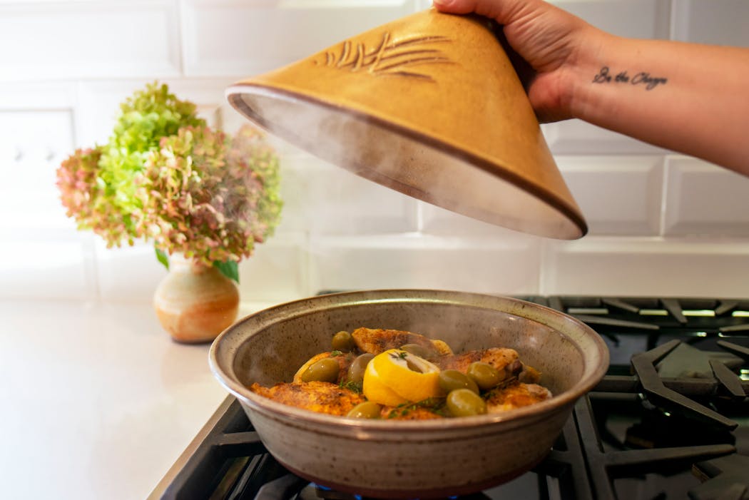 Among Clay Coyote owner Morgan Baum's favorite recipes in the new cookbook: Chicken Tagine with Preserved Lemons, Olives and Thyme. Clay Coyote is the only studio in the country making clay stovetop tagines.