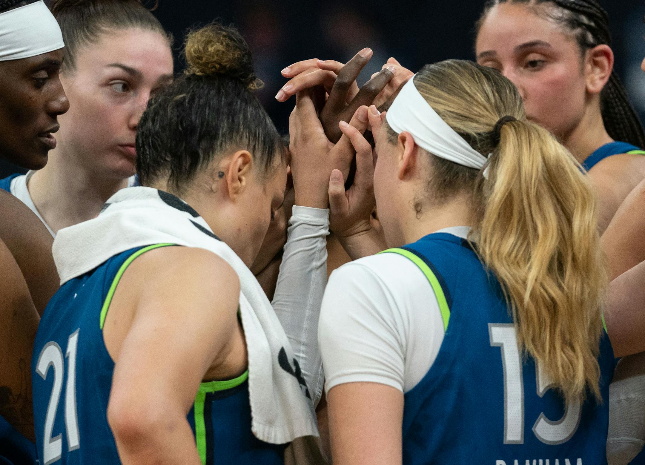 Minnesota Lynx teammates embrace after losing 85 to 91 against the Las Vegas Aces.