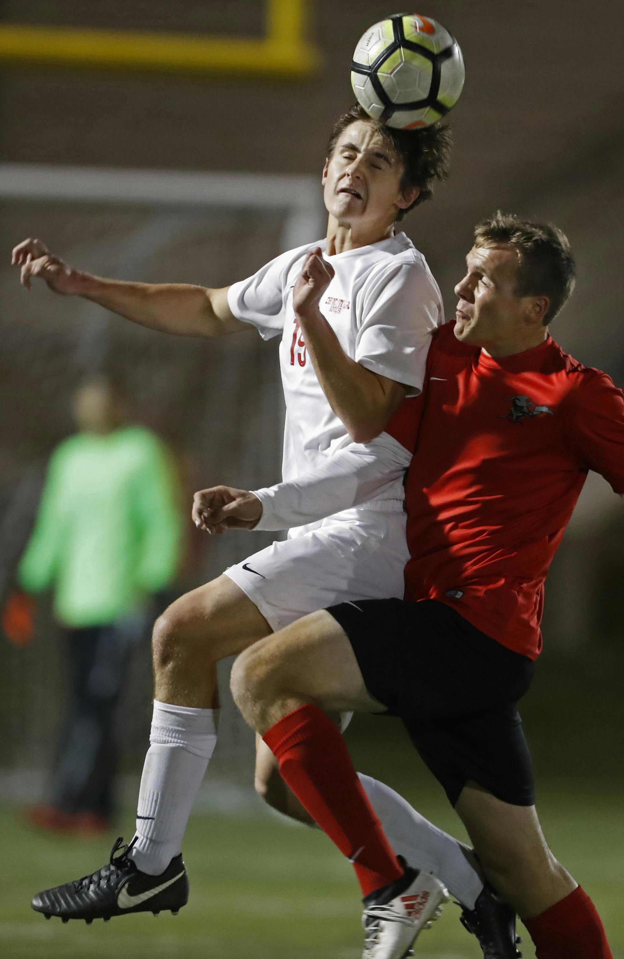 Max Percy(19) and William Francis(4) of Duluth East clash for the ball.]] Class 2A boys' soccer quarterfinals,Duluth East vs. Centennial. Richard Tsong-Taatarii•Richard.Tsong-Taatarii@startribune.com.
