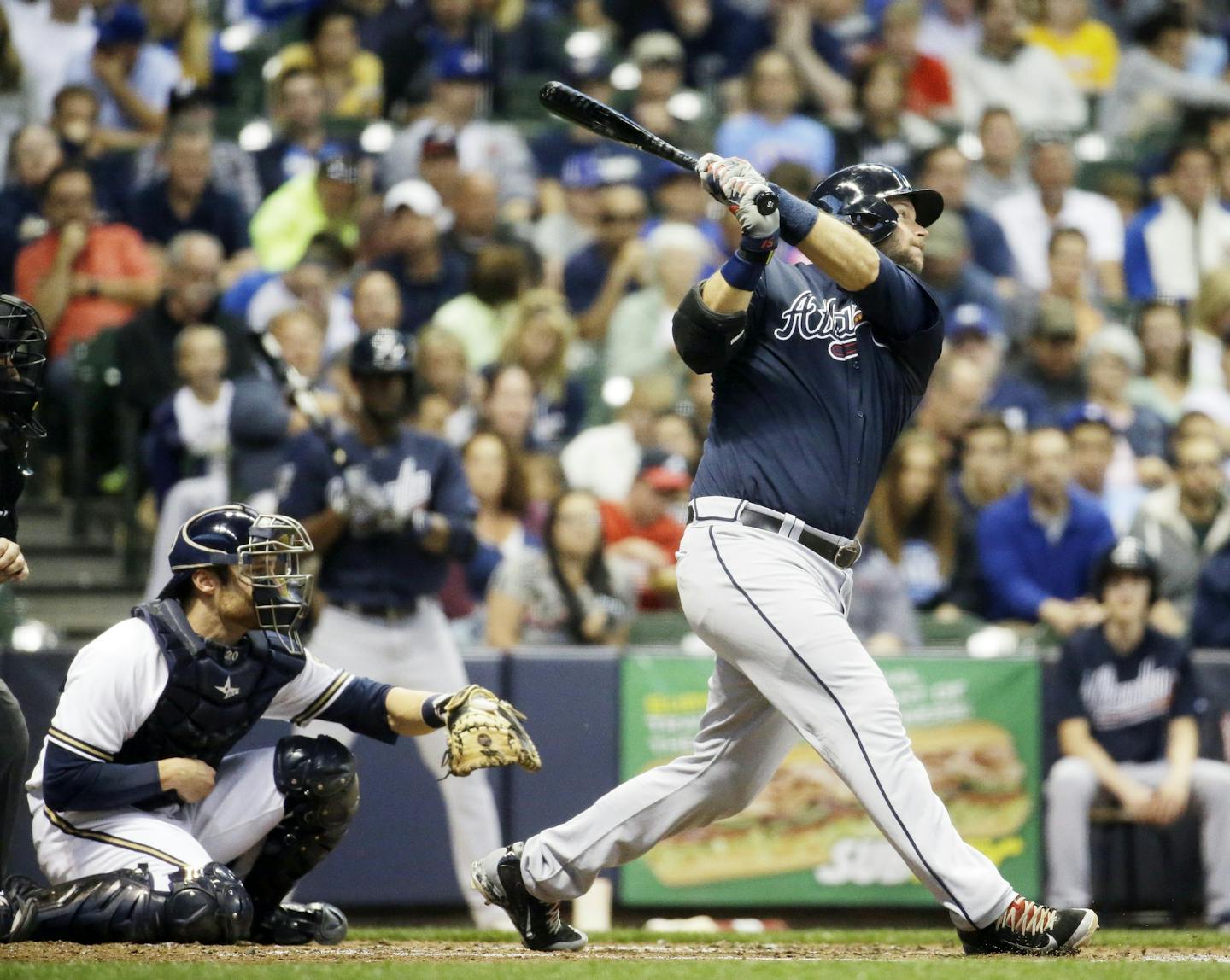 Atlanta Braves' A.J. Pierzynski hits an RBI single during the fourth inning of a baseball game against the Milwaukee Brewers Tuesday, July 7, 2015, in Milwaukee. (AP Photo/Morry Gash) ORG XMIT: WIMG1