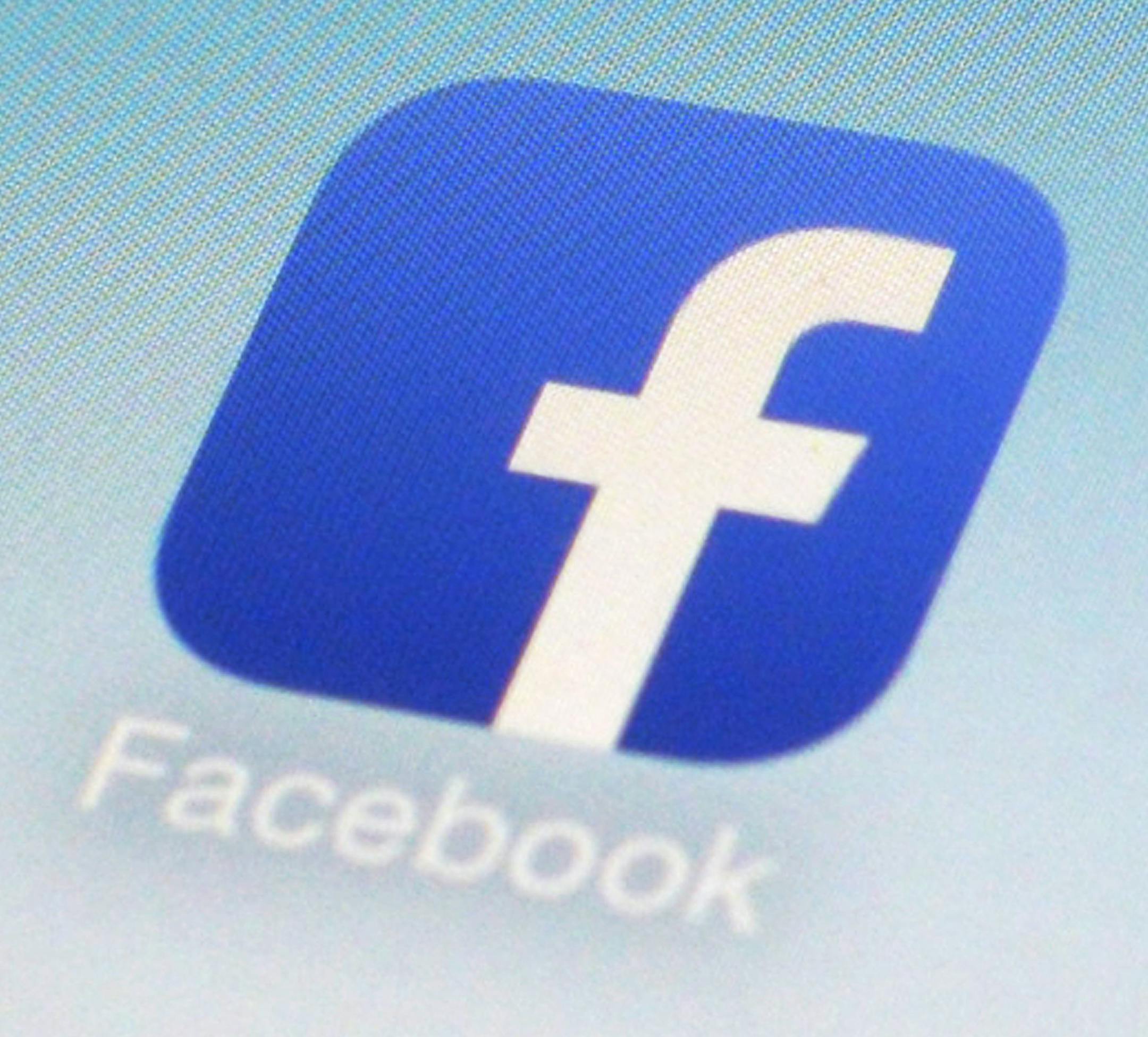 FILE - This Feb. 19, 2014 file photo shows WhatsApp and Facebook app icons on a smartphone in New York. One sign of the growing confidence in the US economy was an increase in corporate deals. One of the most high-profile was Facebookís $22 billion acquisition of the mobile-messaging application WhatsApp. (AP Photo/Patrick Sison, File)