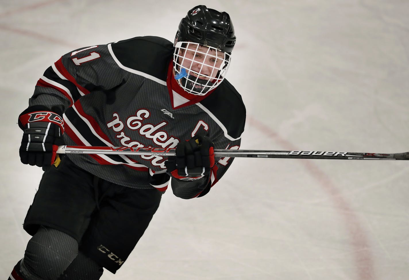 In this Feb. 2, 2017, photo, Eden Prairie forward Casey Mittelstadt skated during a high school hockey game in Minnetonka, Minn. Mittelstadt was presented the 2017 Mr. Hockey Award given to Minnesota's top senior skater on Sunday, March 12, 2017. Mittelstadt tallied 23 goals and 49 assists in 30 games this season. He has committed to the Minnesota Gophers and is a projected first-round pick in the June NHL Draft. (Carlos Gonzalez/Star Tribune via AP)