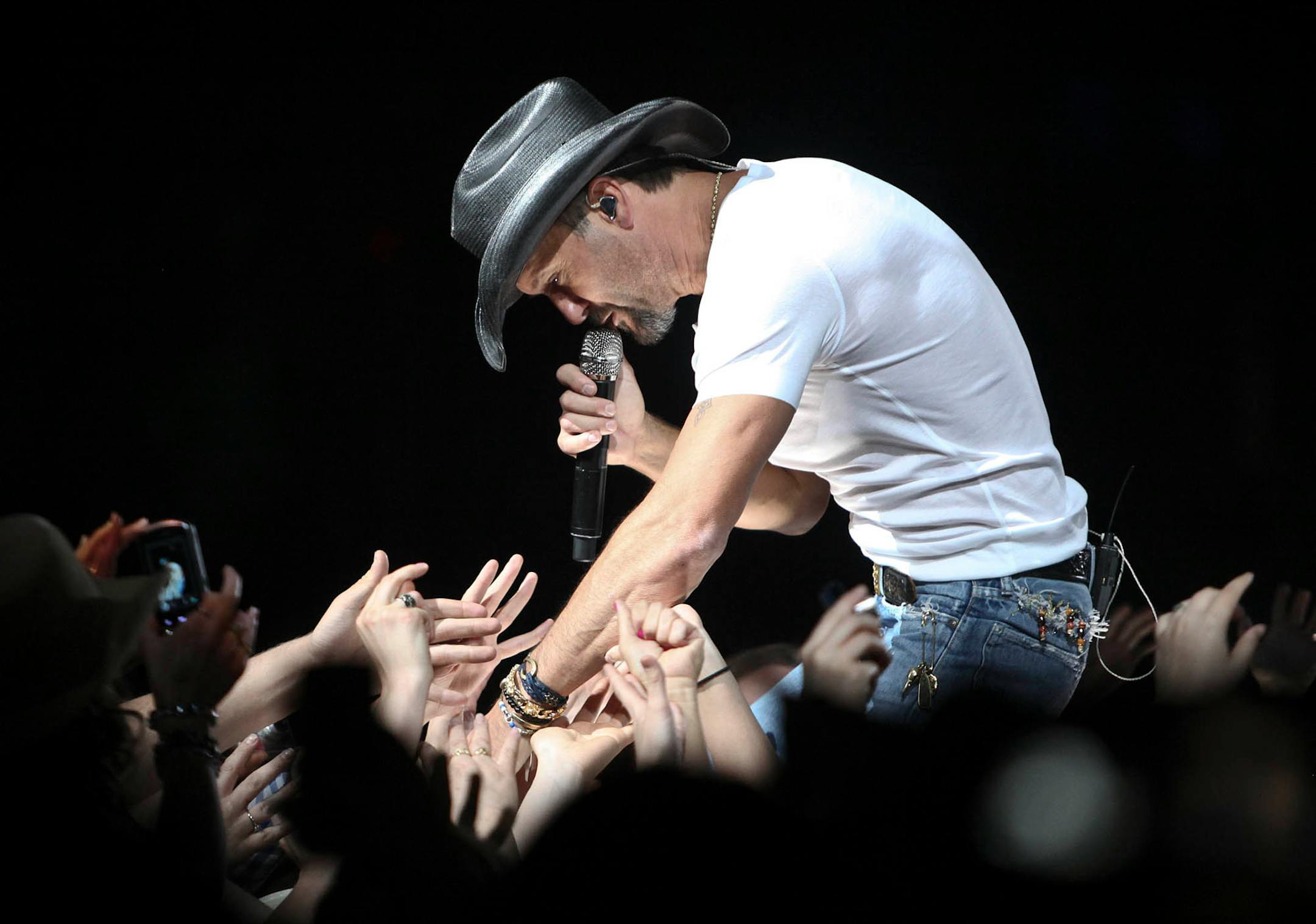 Tim McGraw greeted fans as he performed "BBQ" at the Xcel Energy Center in May 2011.