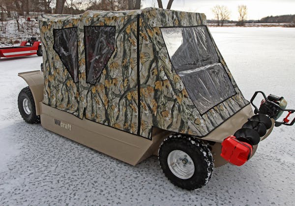 Tom Roering, President of Multifarious, maker of the Wilcraft, described the features of the ice fishing vehicle on 1/4/12 on frozen Spoon Lake in Map