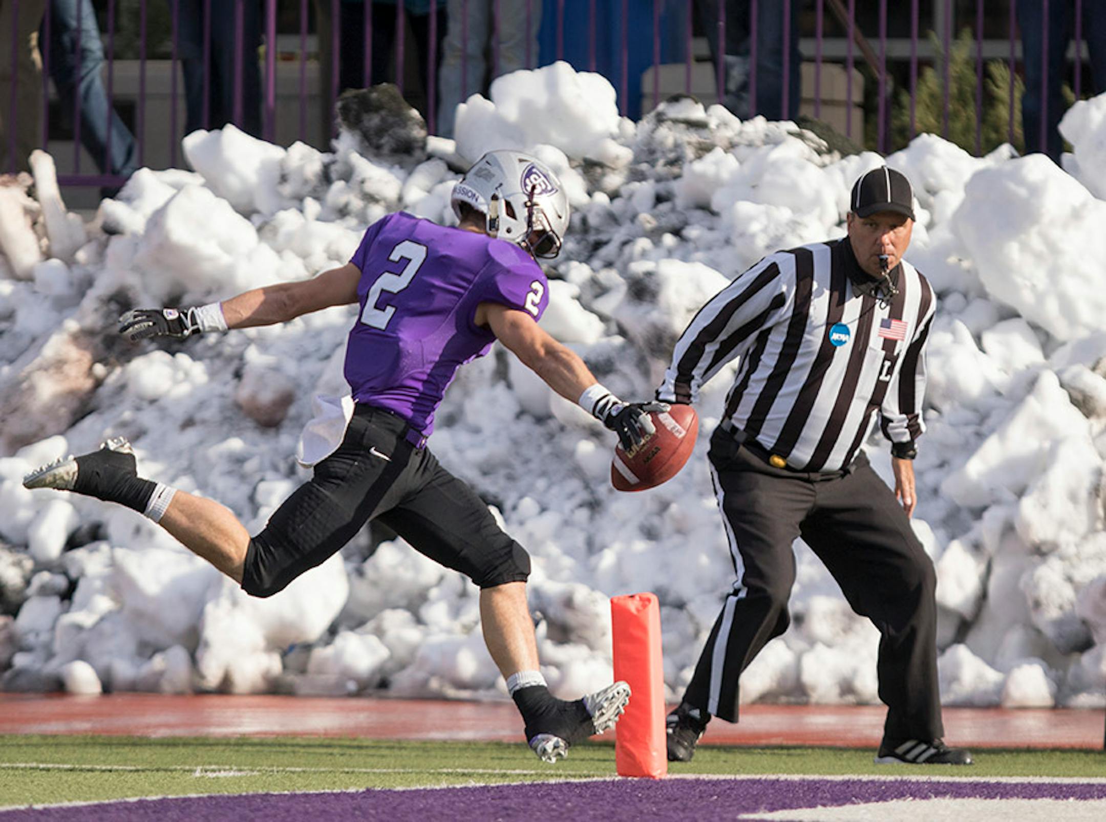 St. Thomas receiver Nick Waldvogel (2) runs a punt back for a touchdown as the University of St. Thomas Tommies hosted the Wabash College Little Giants on December 5, 2015.