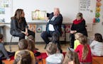 Gov. Tim Walz, along with Lt. Gov. Peggy Flanagan and First Lady Gwen Walz, read to kindergartners at Adams Spanish Immersion Elementary School in St.