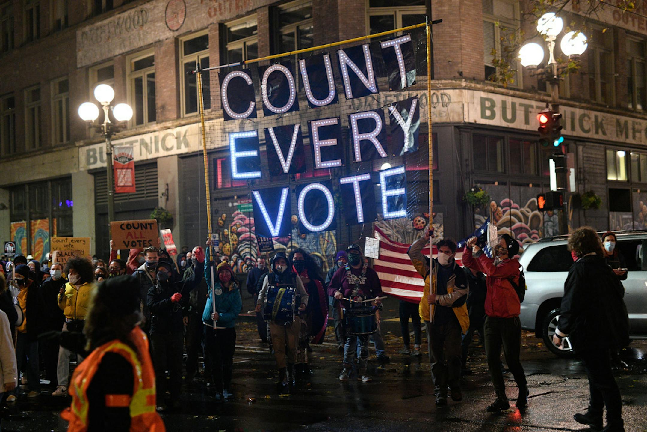 Protesters calling for every vote to be counted march through downtown Seattle on Wednesday evening, Nov. 4, 2020. Protests over ballot tallies are sweeping through U.S. cities.