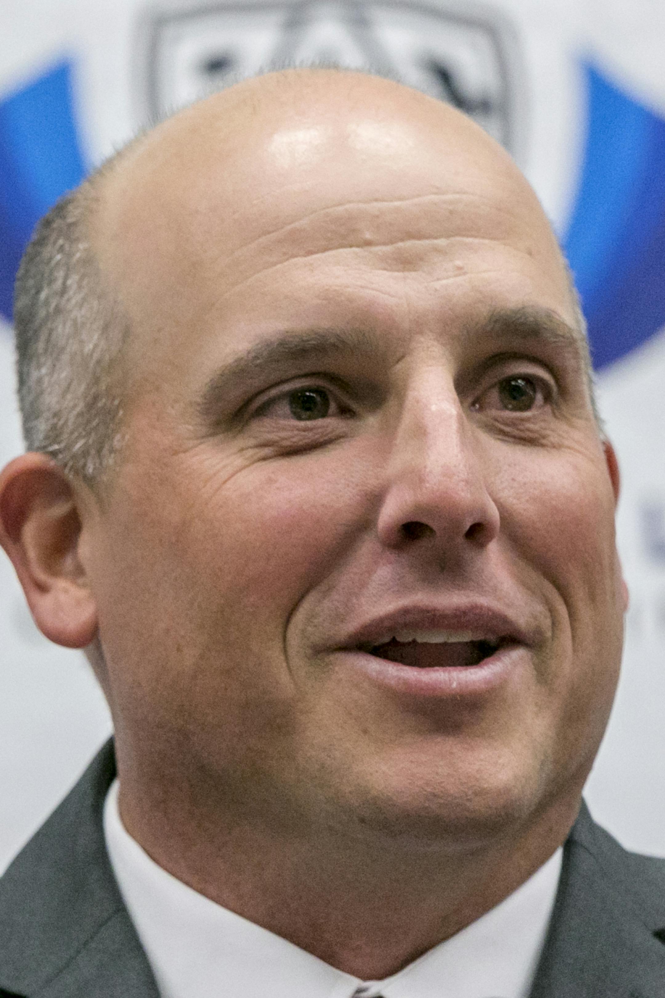 Southern California new coach Clay Helton takes questions from members of the media in Los Angeles, Monday, Nov. 30, 2015. USC hired Helton as its permanent coach on Monday, removing the interim tag five days before the Trojans face Stanford in the Pac-12 championship game. (AP Photo/Damian Dovarganes)
