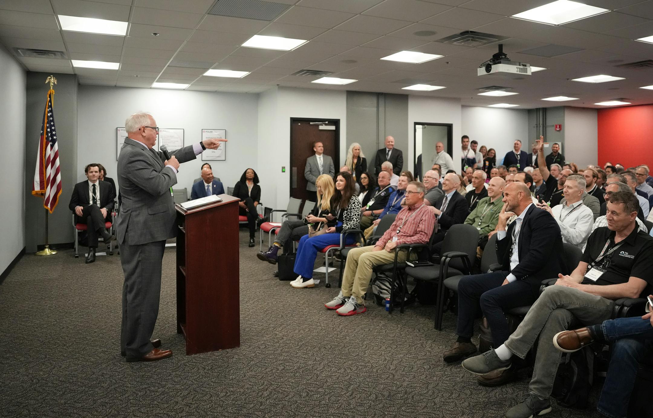 Minnesota Governor Tim Walz speaks to attendees from several semiconductor companies from around the country at Polar Semiconductor in Bloomington, Minn.