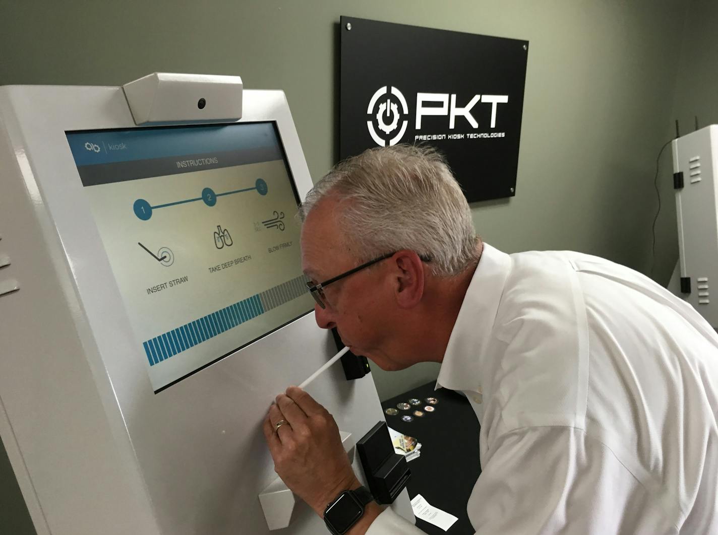 General Manager Patrick McKinney of Minnetonka-based Precision Kiosk Technologies blows into a breathalyzer kiosk that McKinney is providing counties who use it for parolees who need to be tested at least once daily, freeing deputy sheriffs or parole officers for higher-value work.
Photo: Neal.St.Anthony@startribune.com