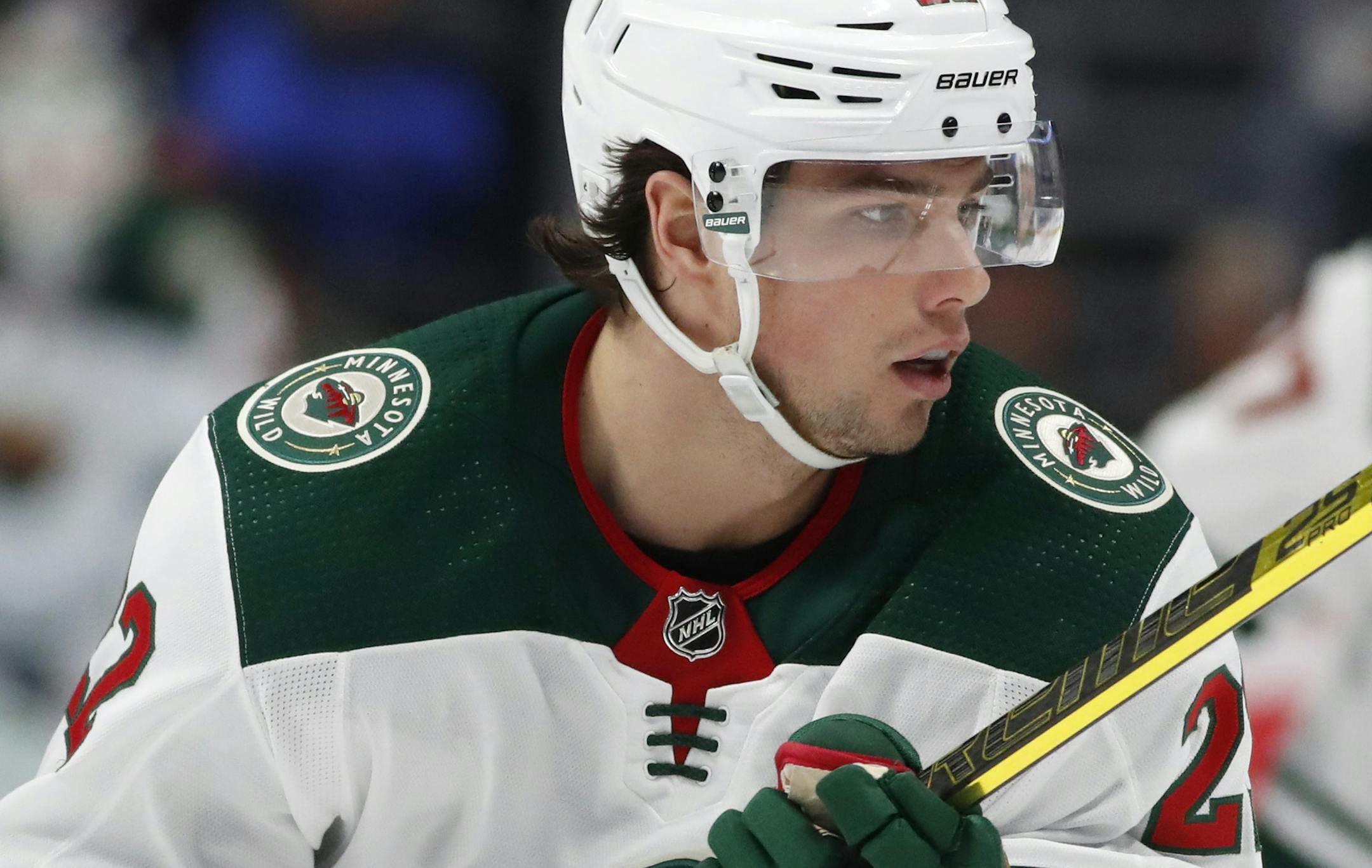 Minnesota Wild left wing Kevin Fiala, right, looks for a pass from a teammate as he drives past Colorado Avalanche left wing J.T. Compher, left, in the second period of an NHL hockey game Friday, Dec. 27, 2019, in Denver. (AP Photo/David Zalubowski)
