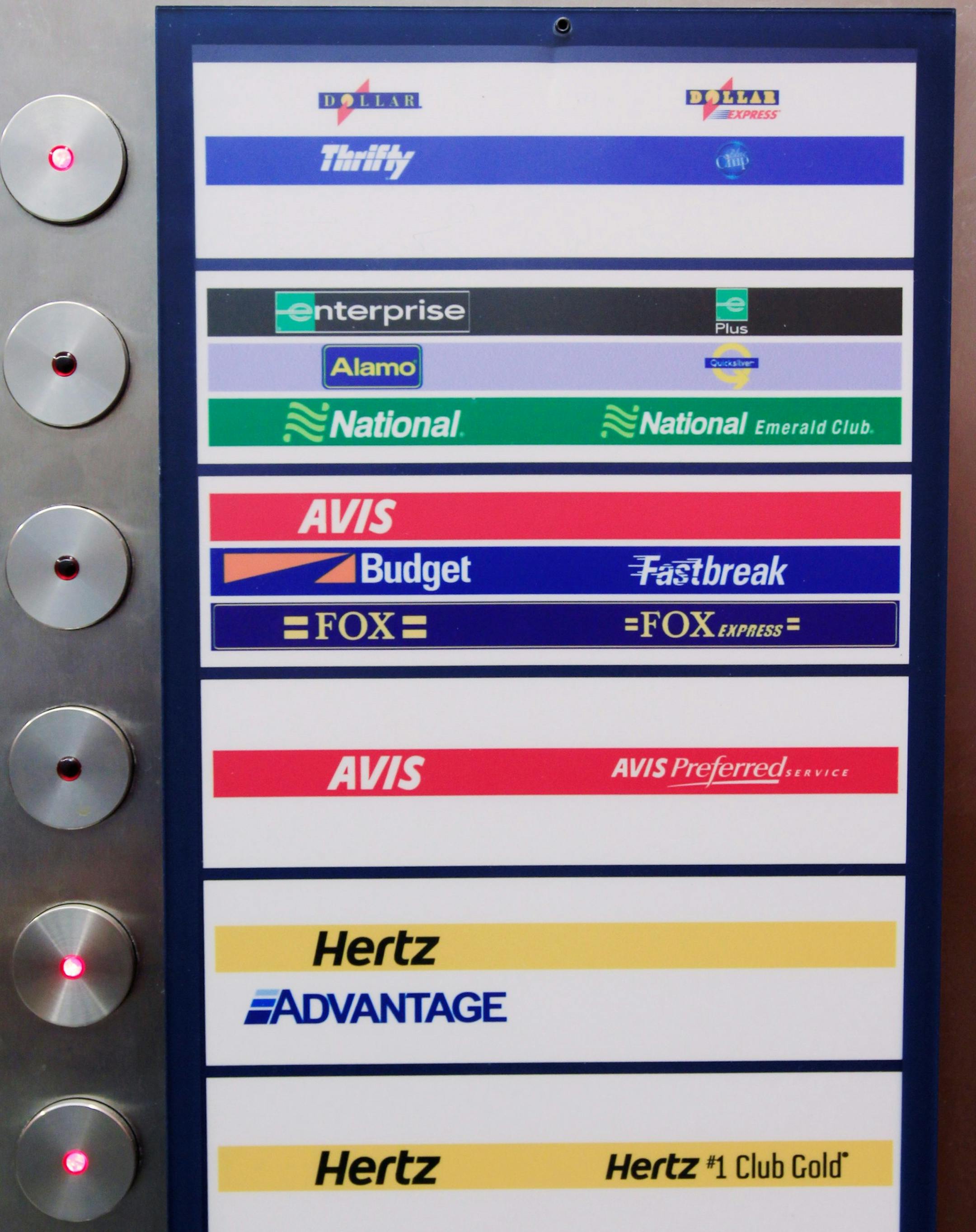 Different rental car companies listed in elevator at San Jose International Airport in San Jose, Calif., Monday, May 9, 2011. Hertz is raising the stakes in its pursuit of Dollar Thrifty Automotive Group Inc. in hopes of besting rival Avis' efforts to acquire the Oklahoma-based car rental agency. (AP Photo/Paul Sakuma) ORG XMIT: CAPS104