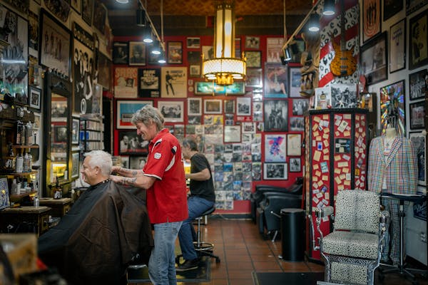 HiFi Hair and Records owner Jon Clifford works on client Bryan Foe in his salon Minneapolis, Minn., on Friday, July 7, 2023. Clifford is doing for the