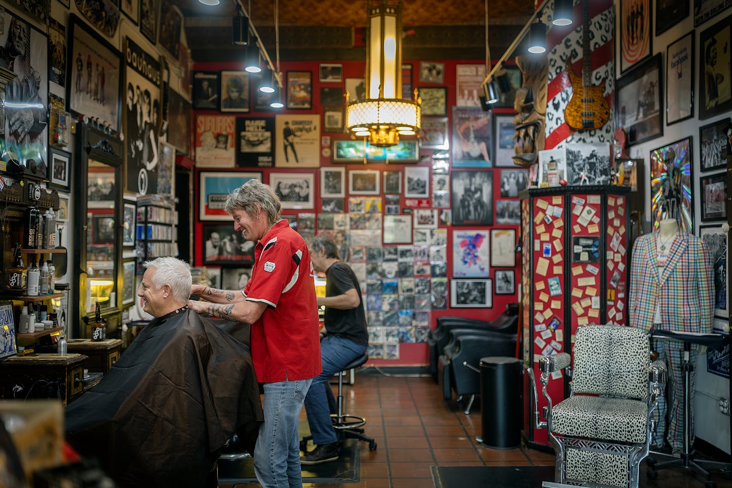 HiFi Hair and Records owner Jon Clifford works on client Bryan Foe in his salon Minneapolis, Minn., on Friday, July 7, 2023. Clifford is doing for the Twin Cities rock scene what he's done for customers at his Loring Park salon for a decade, giving it a boost and a cool style befitting his gregarious energy. He hosts the first of this year's In the Alley shows behind the salon on Sunday, 7/16 ] Elizabeth Flores • liz.flores@startribune.com