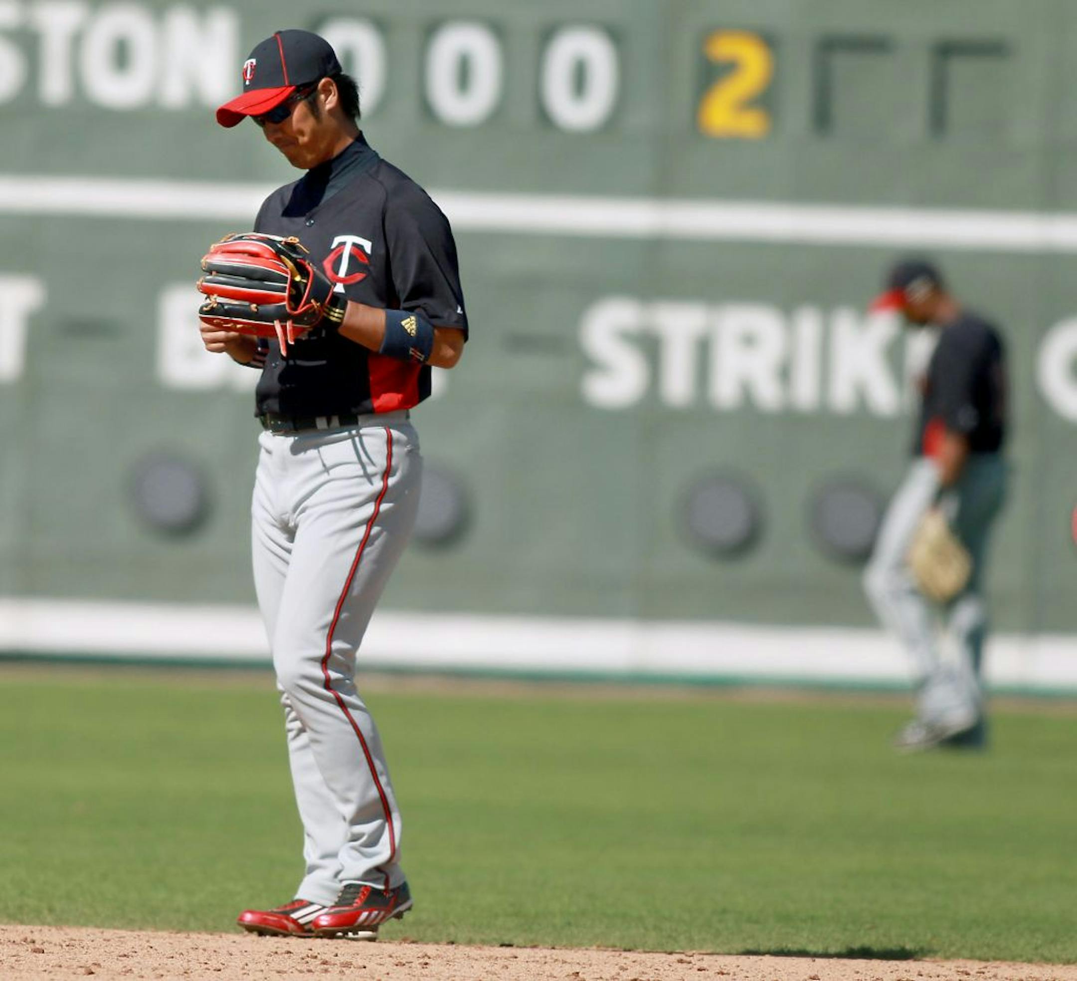 Minnesota Twins Tsuyoshi Nishioka looked discouraged after he made his second error in the fourth inning in the new jetBlue Park, Sunday, March 4, 2012. . (ELIZABETH FLORES/STAR TRIBUNE) ELIZABETH FLORES � eflores@startribune.com