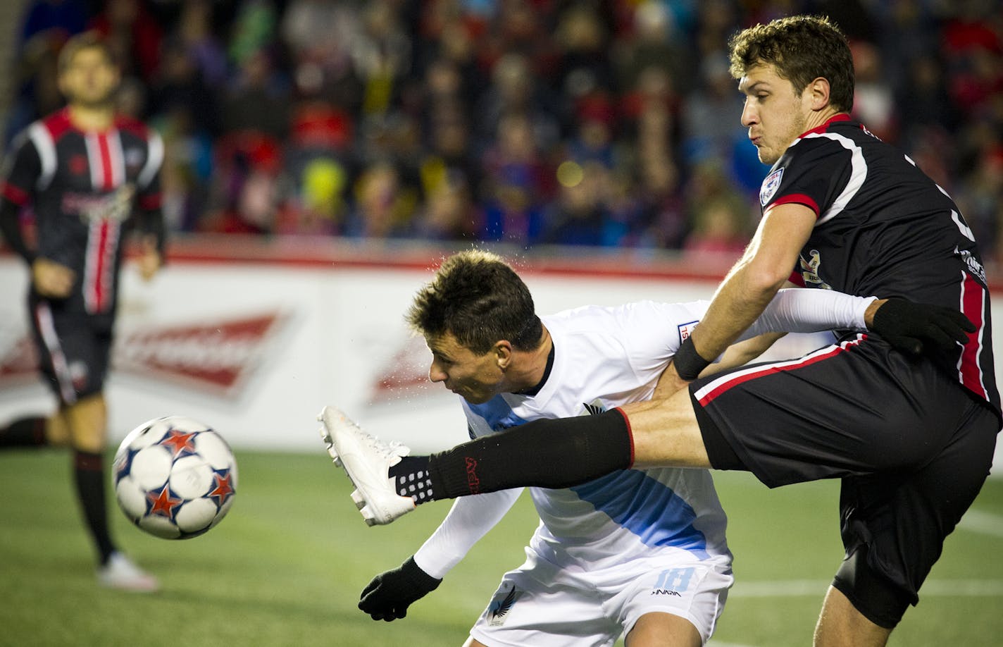 The Ottawa Fury's Mason Trafford kicks Minnesota United's Daniel Mendes in the second half of the North American Soccer League Championship Semifinal Sunday November 8, 2015 at TD Place in Ottawa, Canada.