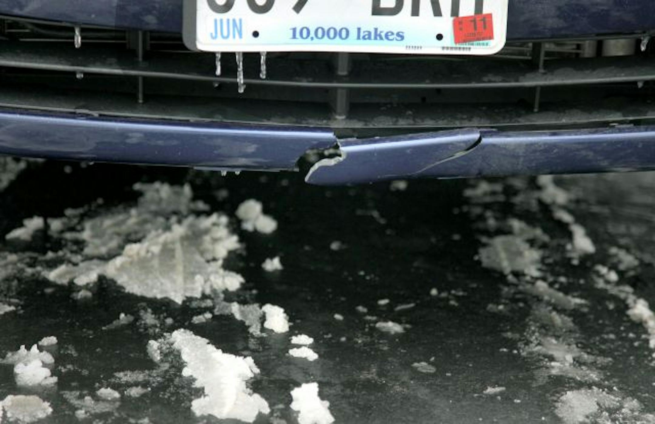 The visible damage to Julie Sucky's car.