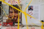 Posters hang on a wall in Tel Aviv, Israel, of Andrey Kozlov, 27, and Noa Argamani, 26, who were recently rescued from Hamas captivity after they were