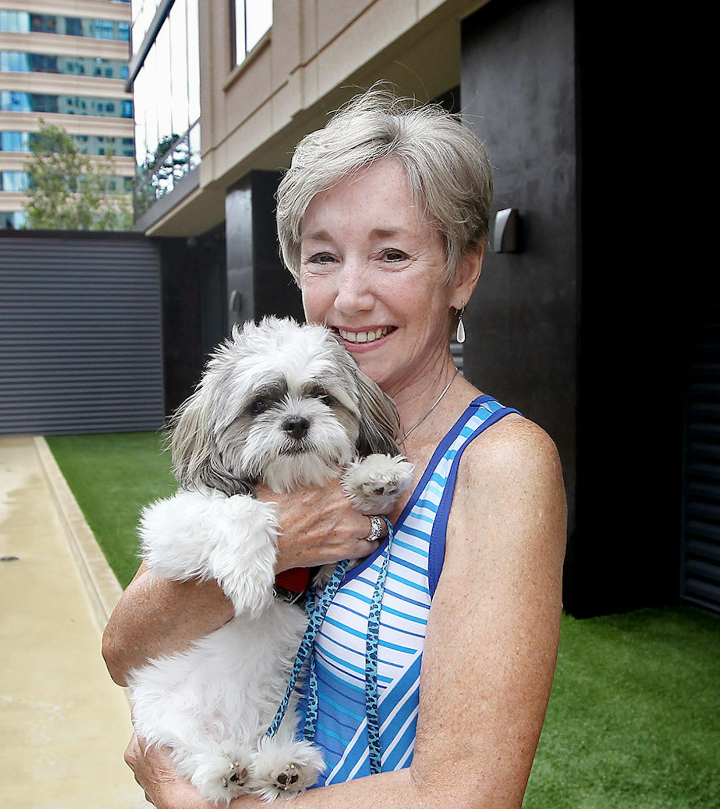 Kate Maher, who held her dog "Chewbacca" said that the the communal deck and dog run "sealed the deal" for her when she was looking for a place to rent, Wednesday, July 8, 2015 in downtown Minneapolis, MN. ] (ELIZABETH FLORES/STAR TRIBUNE) ELIZABETH FLORES &#x2022; eflores@startribune.com