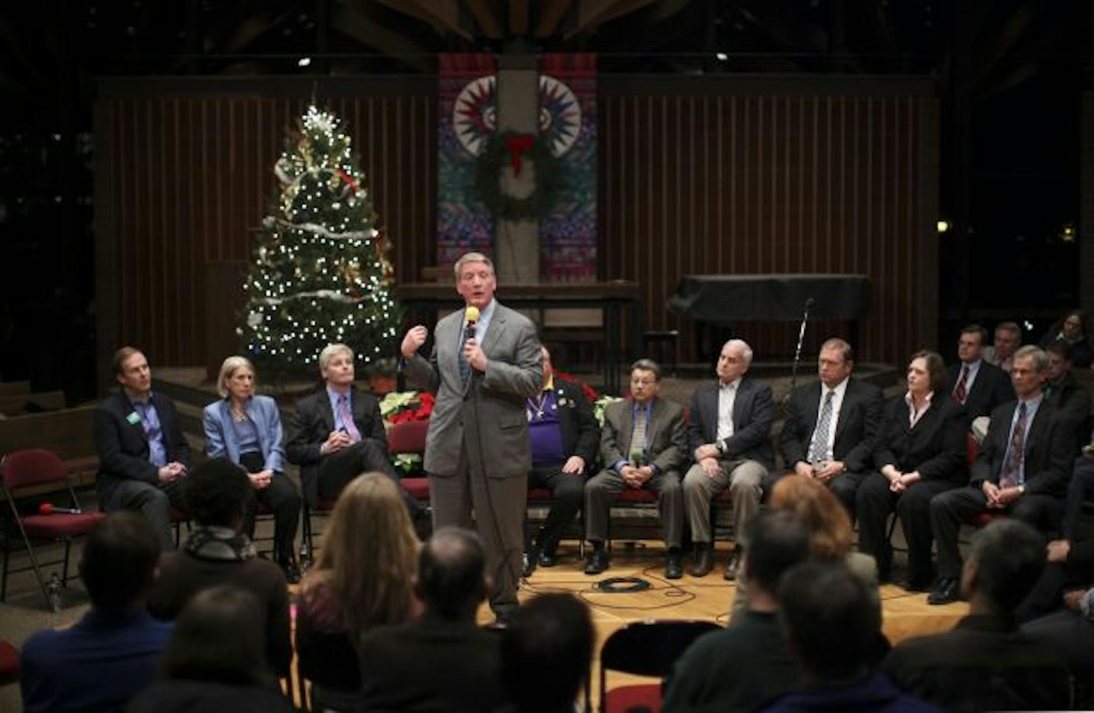The long interview for state's top job begins: Steve Kelley answered a question about health care as other DFL candidates for governor listened Monday night in the Weyerhauser Chapel at Macalester College. The other candidates were, from left: Matt Entenza, Susan Gaertner, Paul Thissen, Ole Savior (partially obscured), Tom Rukavina, Mark Dayton, Tom Bakk, Margaret Anderson Kelliher and John Marty (partially obscured). Minneapolis Mayor R.T. Rybak wasn't able to leave a City Council meeting in ti