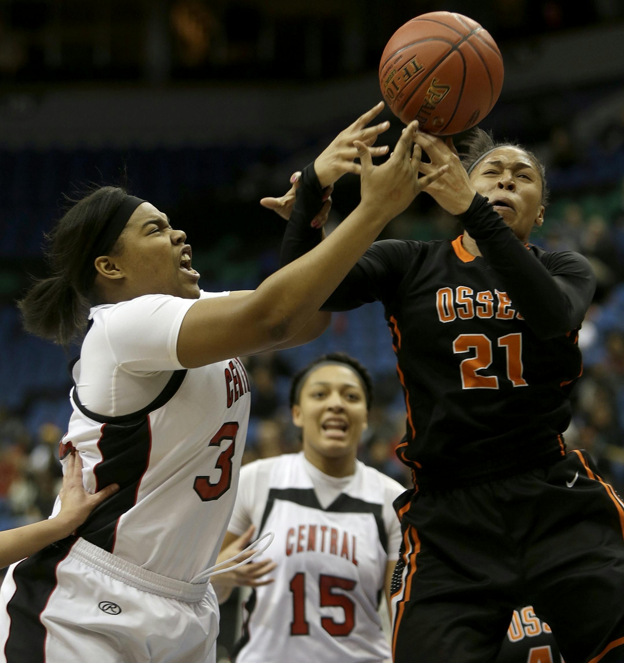 St. Paul Central's Lashondra Curtis and Osseo's Phillis Webb battled for the ball under the basket during the first half of the girls' basketball quarterfinals at Target Center, Wednesday, March 13, 2013 in Minneapolis, MN. (ELIZABETH FLORES/STAR TRIBUNE) ELIZABETH FLORES � eflores@startribune.com