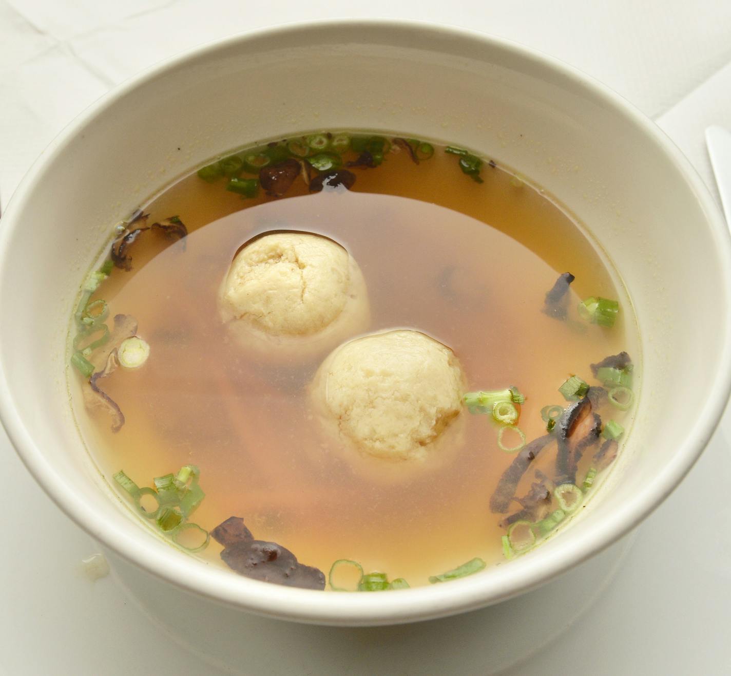 Matzo ball soup with shiitake mushrooms.