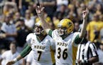 North Dakota State kicker Cam Pedersen (36) reacts with holder Cole Davis (7) after kicking a 37-yard field goal on the final play of an NCAA college 