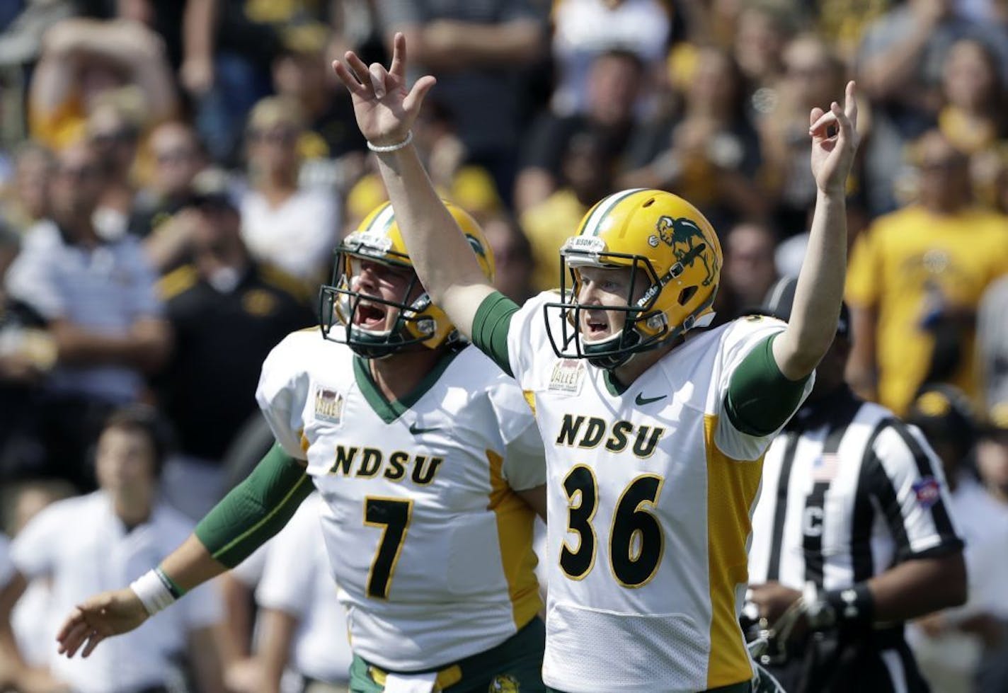 North Dakota State kicker Cam Pedersen (36) reacts with holder Cole Davis (7) after kicking a 37-yard field goal on the final play of an NCAA college football game against Iowa, Saturday, Sept. 17, 2016, in Iowa City, Iowa. North Dakota State won 23-21.