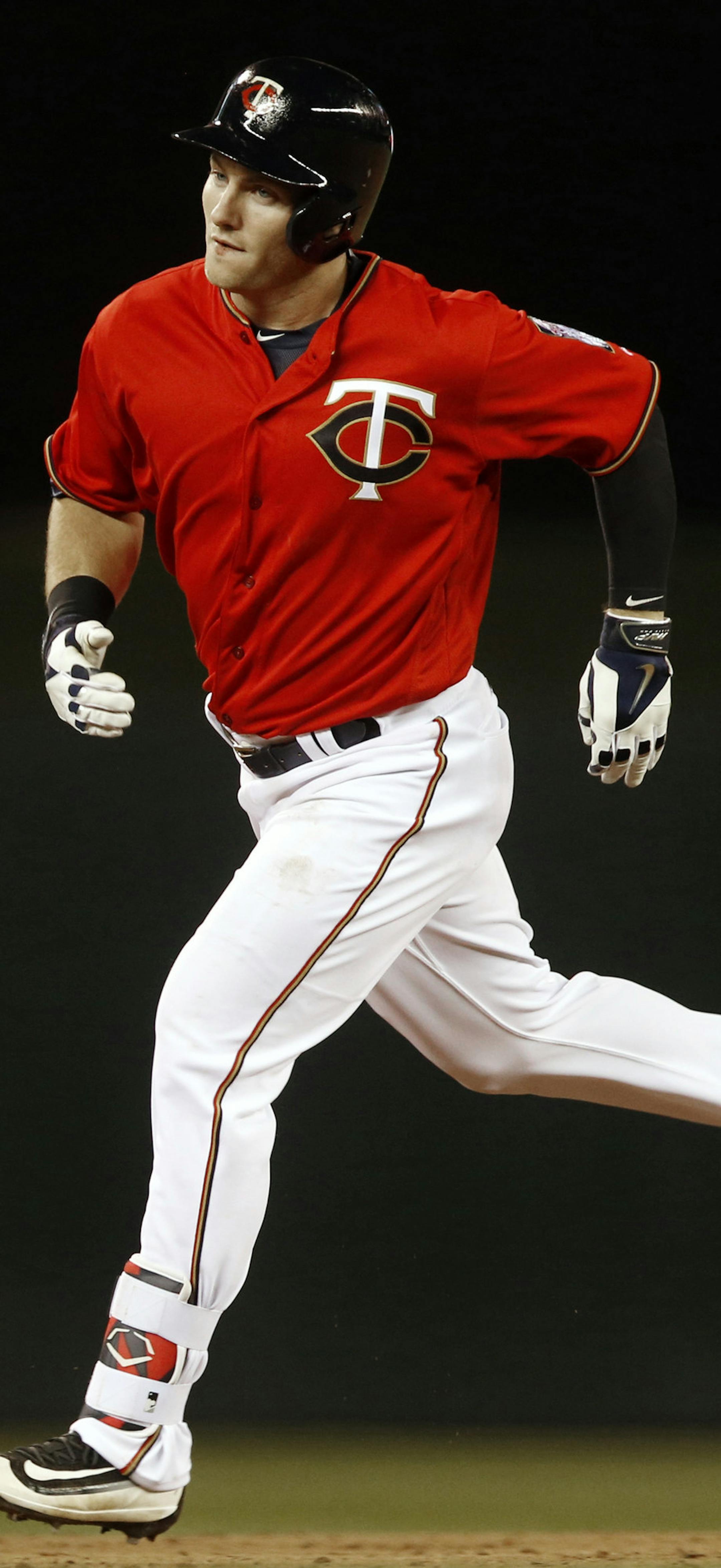 Minnesota Twins' Robbie Grossman rounds the bases on his solo home run off Toronto Blue Jays relief pitcher Chad Girodo during the ninth inning of a baseball game Friday, May 20, 2016, in Minneapolis. The Blue Jays won 9-3. (AP Photo/Jim Mone)