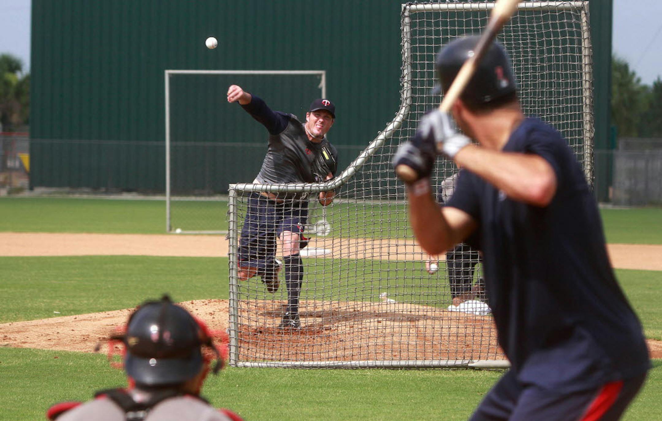 Joe Nathan threw live batting practice to Joe Mauer while working out with the Fort Myers Miracle minor league team on Wednesday.