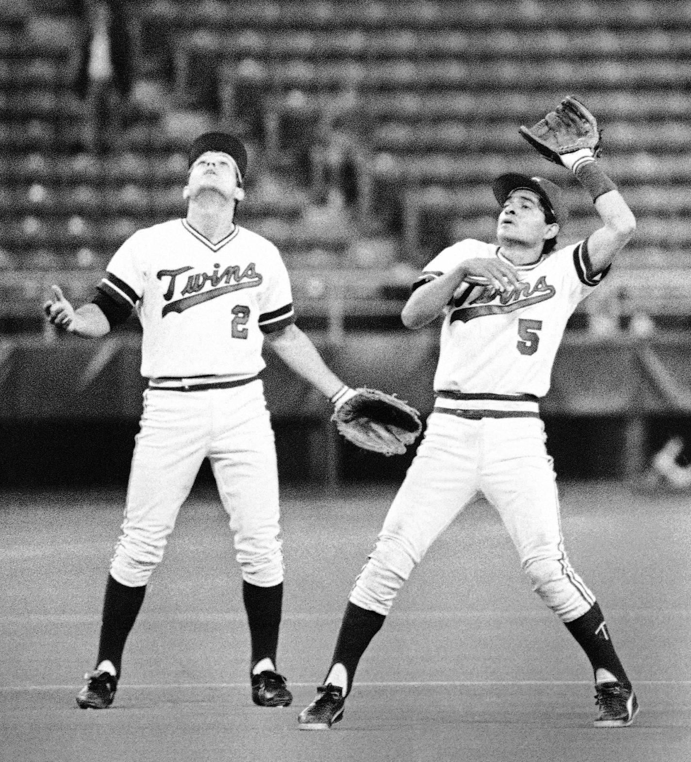 ** ADVANCE FOR WEEKEND EDITIONS, SEPT. 19-20 ** FILE - In this May 4, 1984 file photo, a baffled Minnesota Twins shortstop Houston Jimenez, right and third baseman John Castino waited in vain for the popup off the bat of Oakland Athletics' Dave Kingman in fourth inning of a baseball game in Minneapolis. The ball apparently went into a hole in the fabric ceiling of the Metrodome which is 186 feet at its peak. Kingman was awarded a double on the play. As the Minnesota Twins prepare to move across