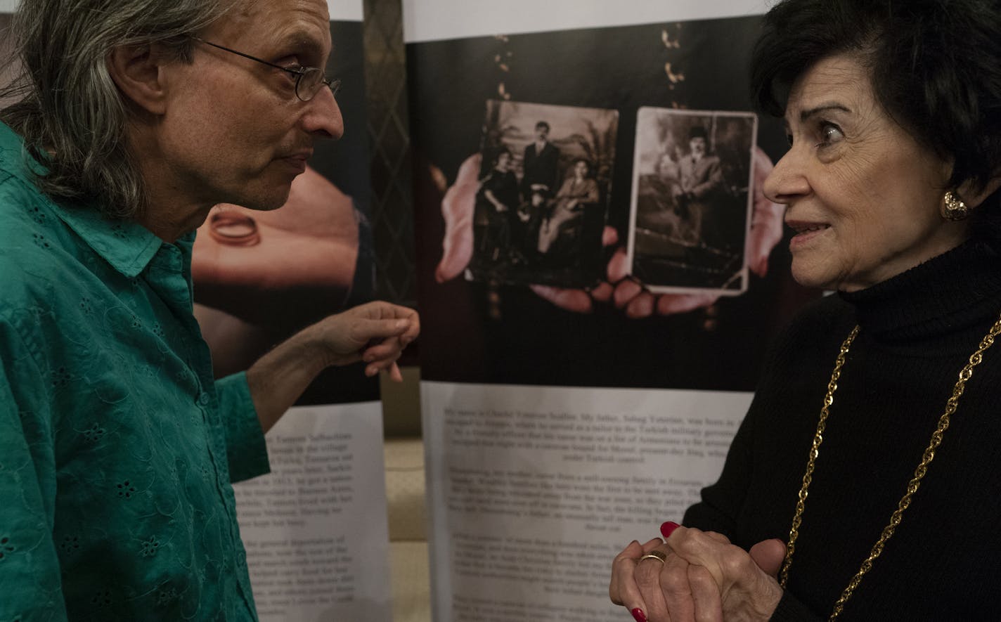 Joel Albers who's father was a holocaust survivor left, listened to Chack&#xe9; Yeterian Scallen as she talked about her family portrait at St. Sahag Armenian Church Wednesday April 24, 2019 in St. Paul, MN.] Opening ceremony for "Treasures of Memory & Hope "were held St. Sahag Armenian Church in St. Paul. The project features photographs by Artyom Tonoyan keeps alive the memory of 1.5 million Armenians killed a century ago. It features an exhibit of ordinary belongings from the extraordinary pe