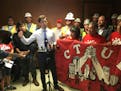 Flanked by union members, Minneapolis mayor Jacob Frey speaks in support of an initiative to crack down on wage theft.