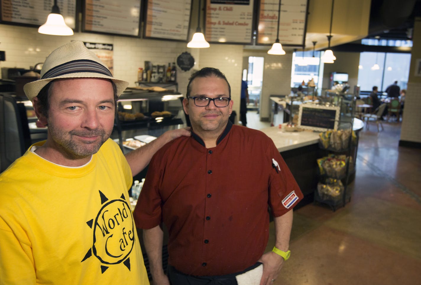 World Cafe co-owners Robert Whitney, left, and Alejandro Cerdas Monge in their Soo Line Building cafe.