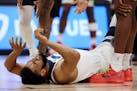 Karl-Anthony Towns of the Wolves was in pain after being fouled in the first quarter against the Nuggets tonight in Denver.