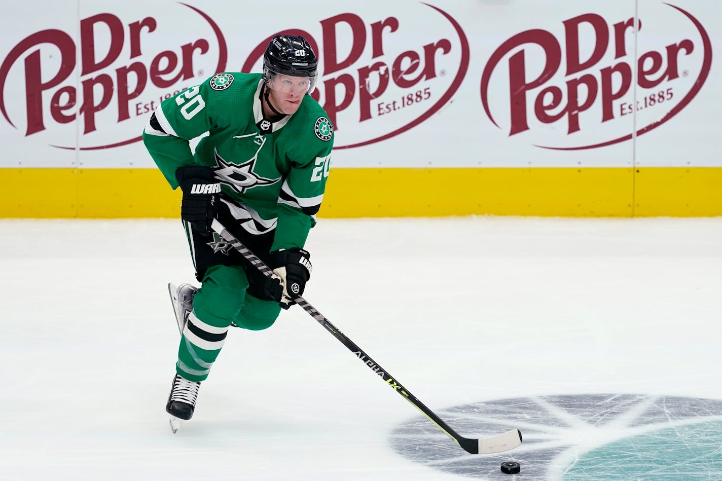 Dallas Stars defenseman Ryan Suter handles the puck during an NHL hockey game against the Nashville Predators in Dallas, Wednesday, Nov. 10, 2021. (AP Photo/Tony Gutierrez)