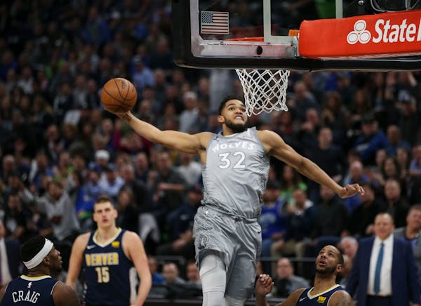 Timberwolves center Karl-Anthony Towns prepared to dunk in the first half.