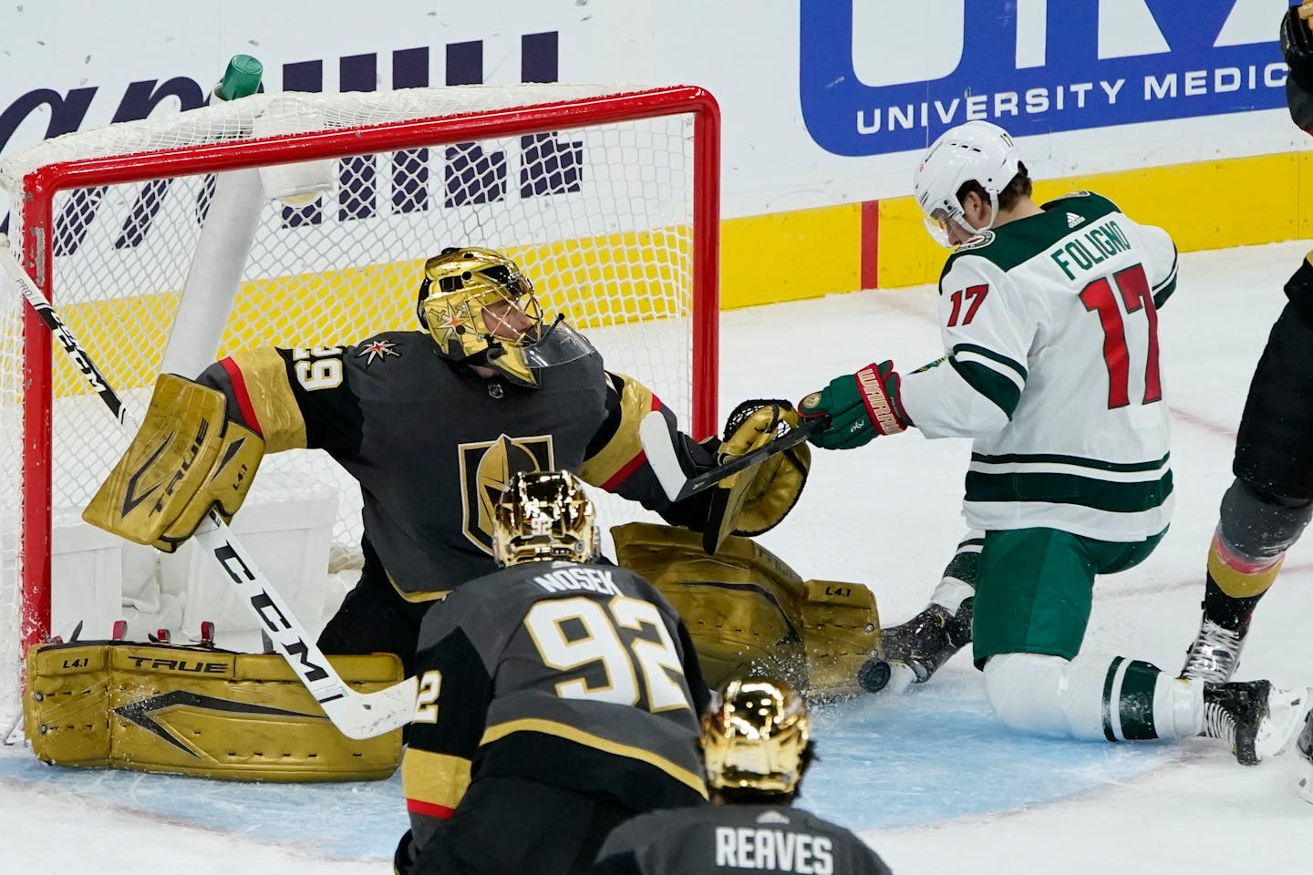 Minnesota Wild left wing Marcus Foligno (17) scores on Vegas Golden Knights goaltender Marc-Andre Fleury (29) during the second period of an NHL hockey game Monday, March 1, 2021, in Las Vegas. (AP Photo/John Locher)