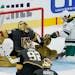 Minnesota Wild left wing Marcus Foligno (17) scores on Vegas Golden Knights goaltender Marc-Andre Fleury (29) during the second period of an NHL hocke